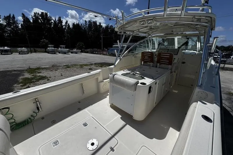 Slide: The Image of 2009 Pursuit 345 Drummond Runner LS boat with spacious deck and seating area. - 8