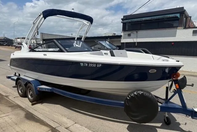 The Image of 2024 Cobalt CS22 boat on trailer, parked outdoors, featuring sleek design and modern features. - 0