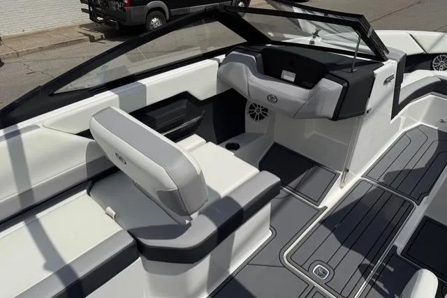 Slide: The Image of 2024 Cobalt CS22 boat interior with sleek seating and modern dashboard design. - 11