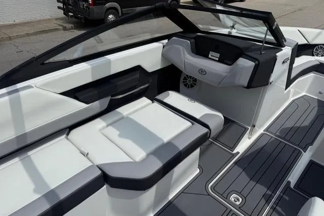 Slide: The Image of 2024 Cobalt CS22 boat interior with sleek seating and modern dashboard design. - 12