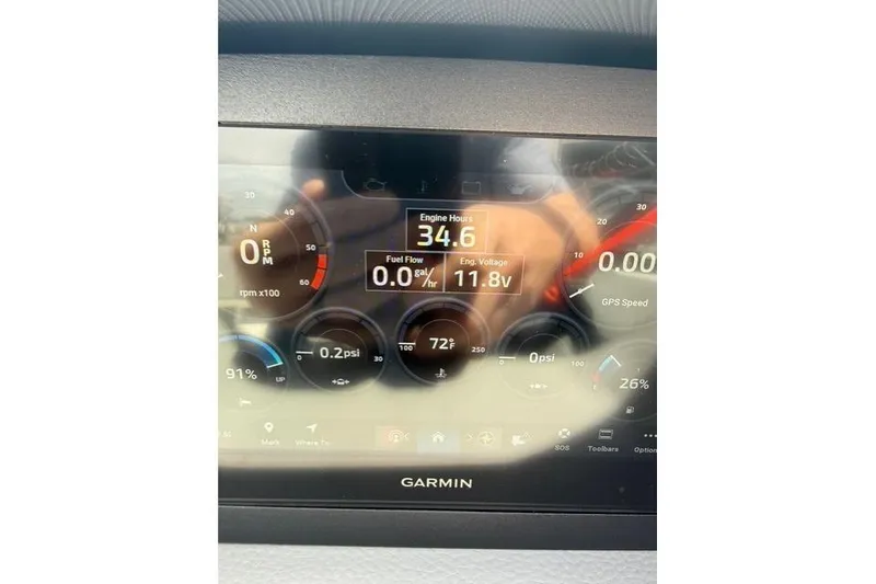 Slide: The Image of Garmin display showing engine metrics on 2024 Cobalt CS22 boat dashboard. - 17