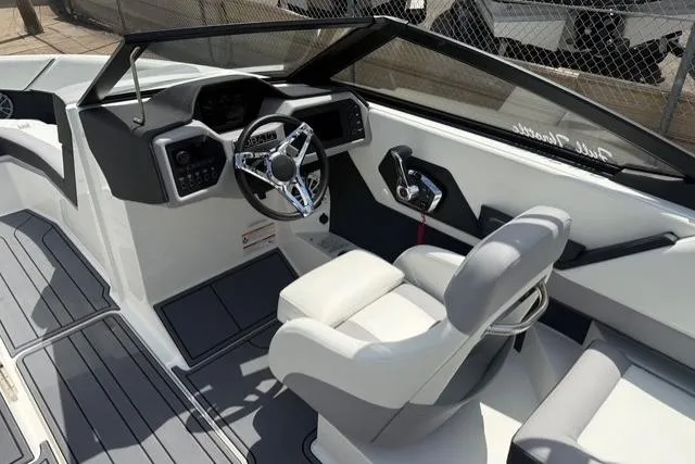 Slide: The Image of 2024 Cobalt CS22 boat interior with sleek steering wheel and modern dashboard design. - 18