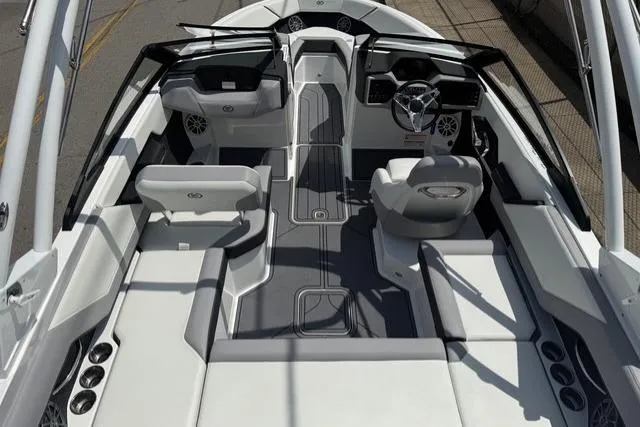 Slide: The Image of 2024 Cobalt CS22 boat interior with sleek seating and modern dashboard design. - 23