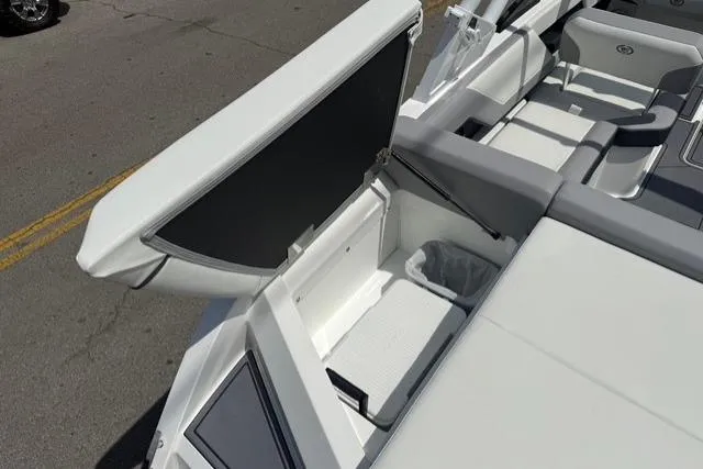 Slide: The Image of 2024 Cobalt CS22 boat interior storage compartment with open lid, showcasing sleek design and functionality. - 24