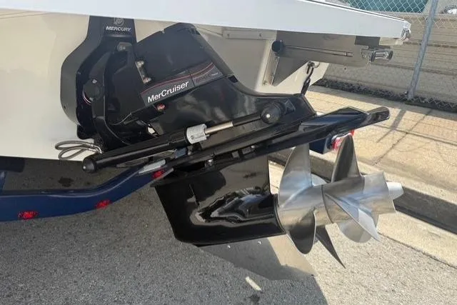 Slide: The Image of 2024 Cobalt CS22 boat with MerCruiser outdrive and stainless steel propeller. - 26