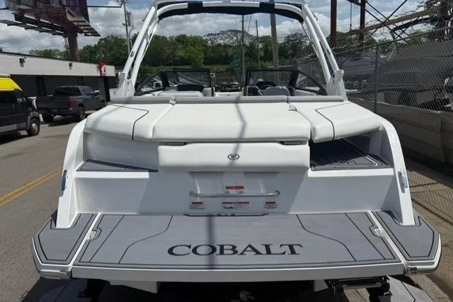 Slide: The Image of 2024 Cobalt CS22 boat, rear view, showcasing sleek design and spacious seating. - 4