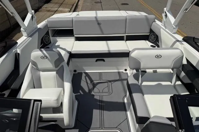 Slide: The Image of 2024 Cobalt CS22 boat interior with sleek white seating and modern design. - 9