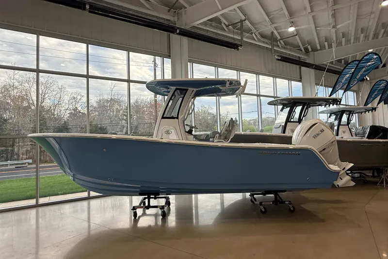 The Image of 2026 Sportsman Open 232 Center Console boat displayed indoors. - 0