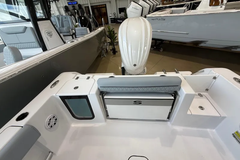 Slide: The Image of 2026 Sportsman Open 232 Center Console boat interior with seating and storage. - 14