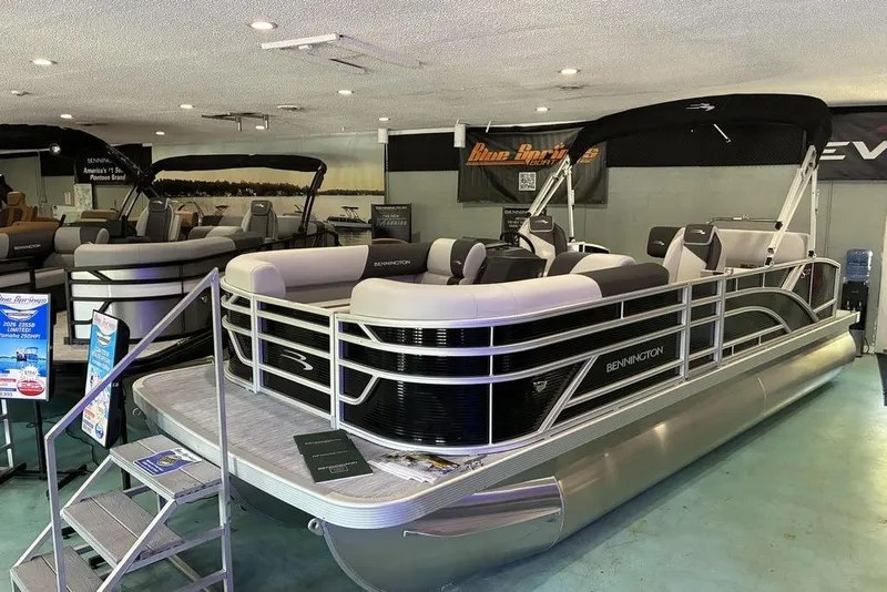 The Image of 2026 Bennington S Quad Bench 22 SSR pontoon boat displayed in showroom. - 0