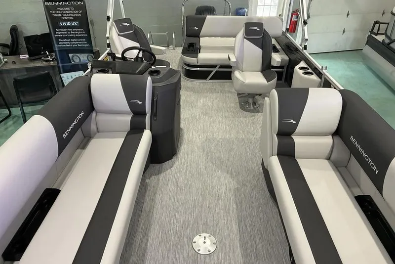 Slide: The Image of 2026 Bennington S Quad Bench 22 SSR pontoon boat interior with stylish seating and modern design. - 2