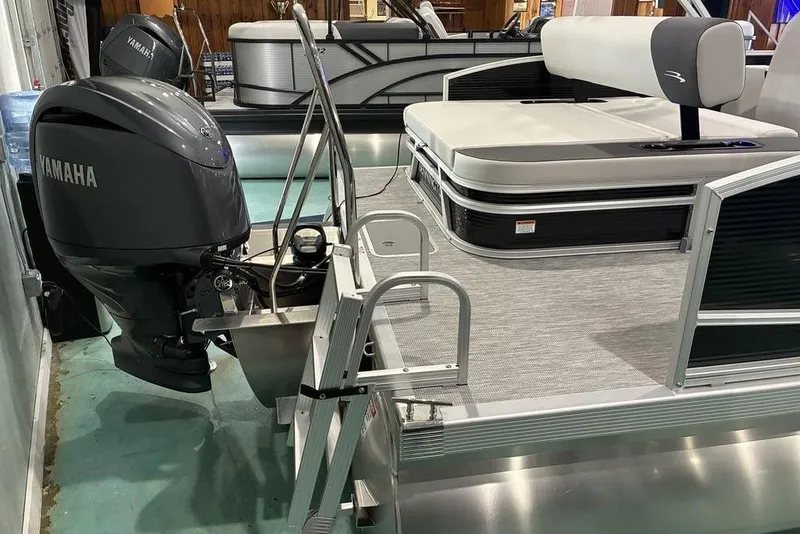Slide: The Image of 2026 Bennington S Quad Bench 22 SSR pontoon boat with Yamaha outboard motor. - 9