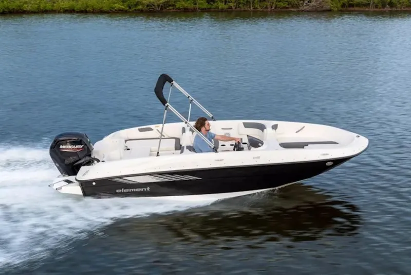 Slide: The Image of 2026 Bayliner Element E18 boat cruising on a calm lake. - 3
