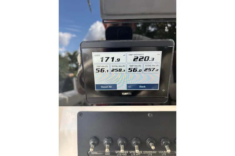 Slide: The Image of Yamaha display on 2021 Cobia 320 Center Console showing trip data and fuel usage. - 10