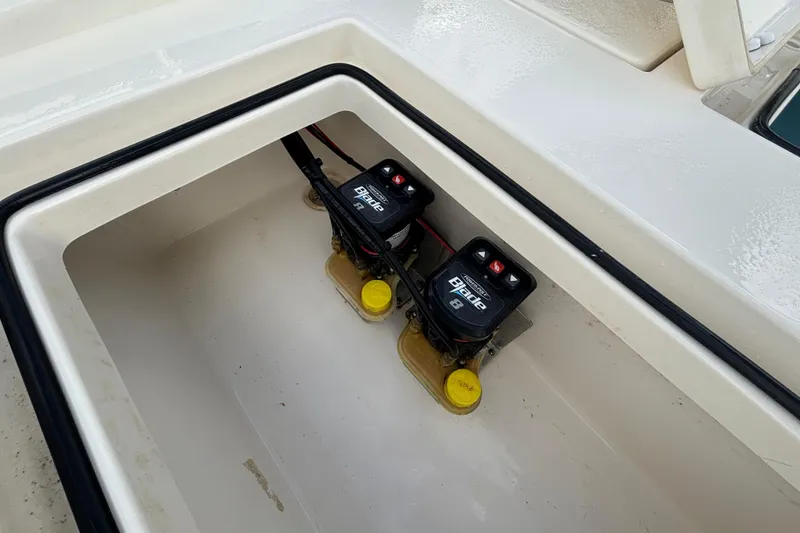 Slide: The Image of Battery compartment of 2023 Pathfinder 2300 HPS boat, featuring dual batteries. - 15