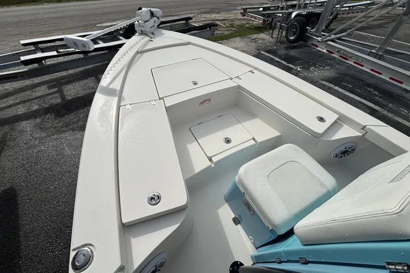 Slide: The Image of 2023 Pathfinder 2300 HPS boat deck with seating and storage compartments. - 18