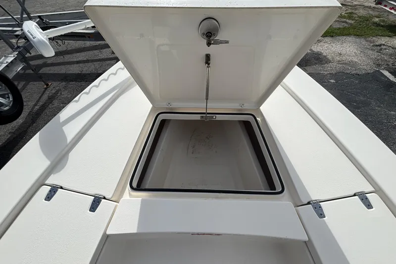 Slide: The Image of Open storage compartment on a 2023 Pathfinder 2300 HPS boat deck. - 6