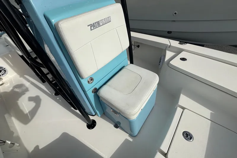Slide: The Image of 2023 Pathfinder 2300 HPS boat interior with blue and white seating. - 9
