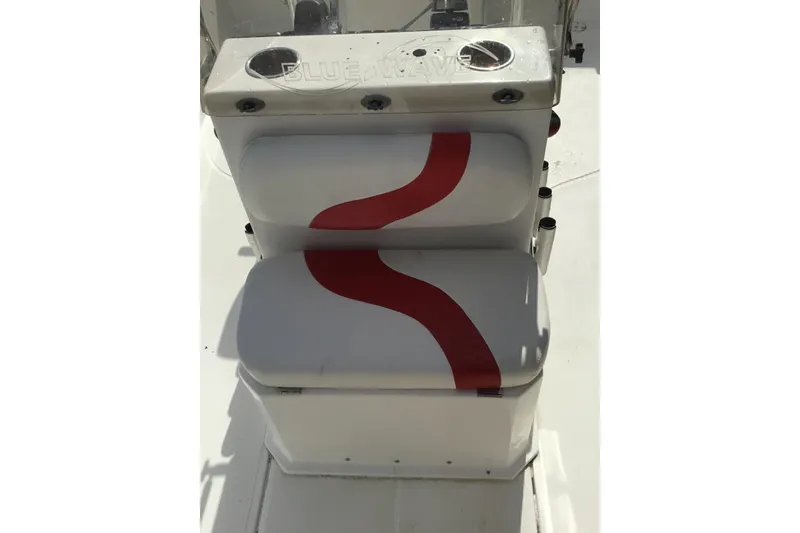 Slide: The Image of 2013 Blue Wave 1900 STL boat seat with red wave design and cup holders. - 14