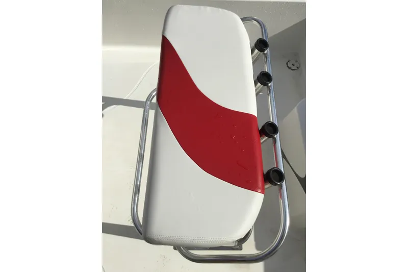 Slide: The Image of White and red boat seat with rod holders on a 2013 Blue Wave 1900 STL. - 15