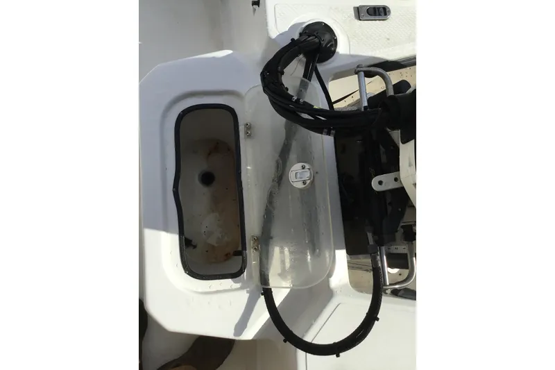 Slide: The Image of 2013 Blue Wave 1900 STL boat interior showing storage compartment and wiring. - 16