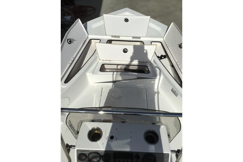 Slide: The Image of 2013 Blue Wave 1900 STL boat interior with open storage compartments. - 17