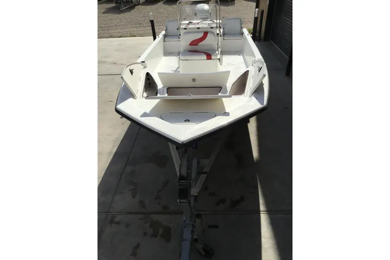 Slide: The Image of 2013 Blue Wave 1900 STL boat on trailer, viewed from above in a garage setting. - 19