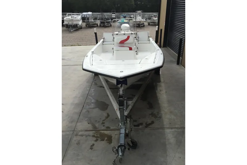 Slide: The Image of 2013 Blue Wave 1900 STL boat on trailer in storage facility. - 6