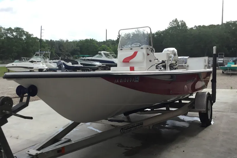 Slide: The Image of 2013 Blue Wave 1900 STL boat on trailer, parked outdoors. - 8