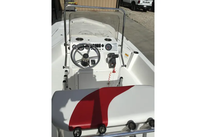 Slide: The Image of 2013 Blue Wave 1900 STL boat interior with steering wheel and control panel. - 9