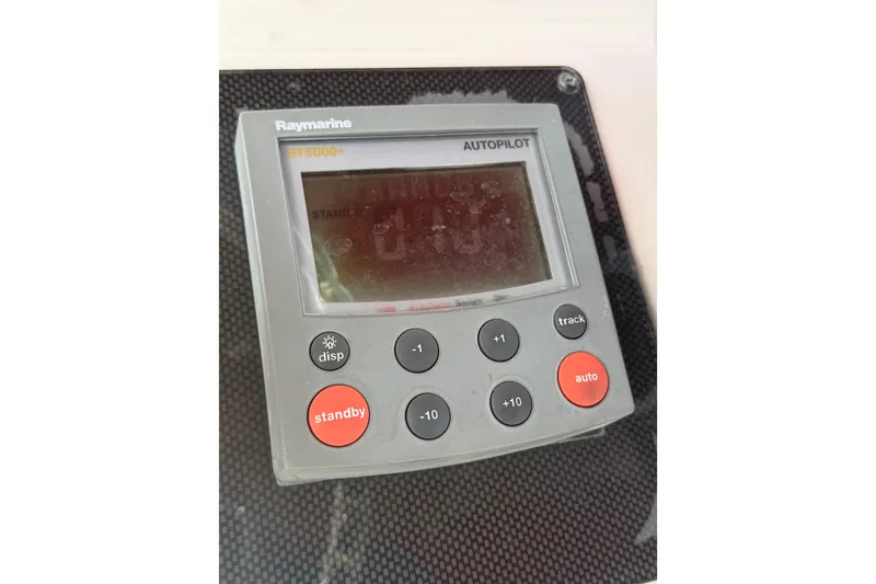 Slide: The Image of Raymarine ST5000+ autopilot control on 1997 Wellcraft 302 Scarab Sport boat. - 11