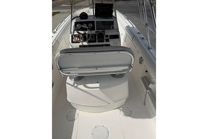 Slide: The Image of 1997 Wellcraft 302 Scarab Sport boat interior with steering console and seating. - 12