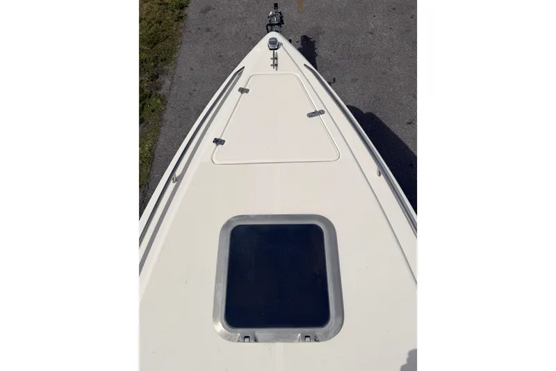Slide: The Image of Bow view of a 1997 Wellcraft 302 Scarab Sport boat, featuring a hatch and clean deck. - 15