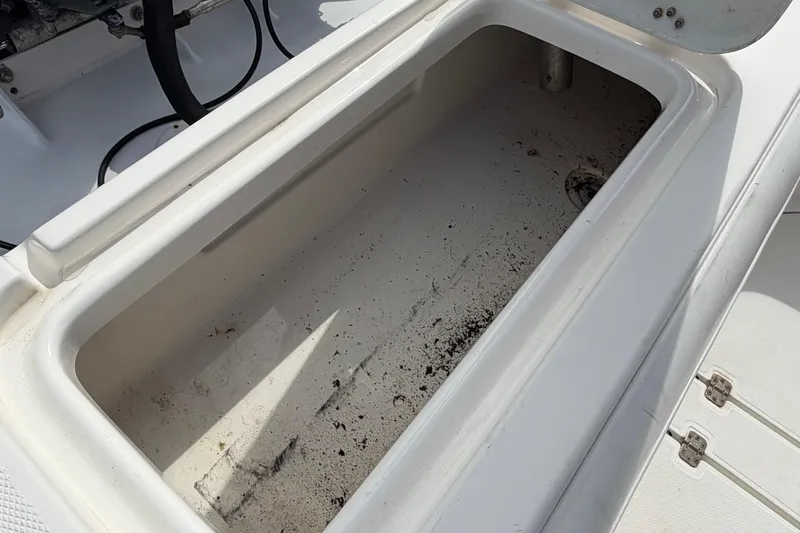 Slide: The Image of Open storage compartment on a 1997 Wellcraft 302 Scarab Sport boat. - 16