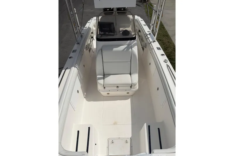 Slide: The Image of 1997 Wellcraft 302 Scarab Sport boat interior with white seating and console. - 17