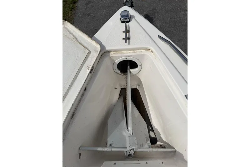 Slide: The Image of Bow view of 1997 Wellcraft 302 Scarab Sport boat, featuring anchor storage. - 18