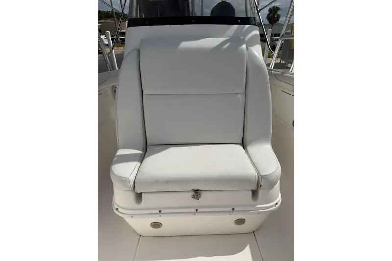 Slide: The Image of White seat on 1997 Wellcraft 302 Scarab Sport boat, featuring sleek design and comfortable cushioning. - 19