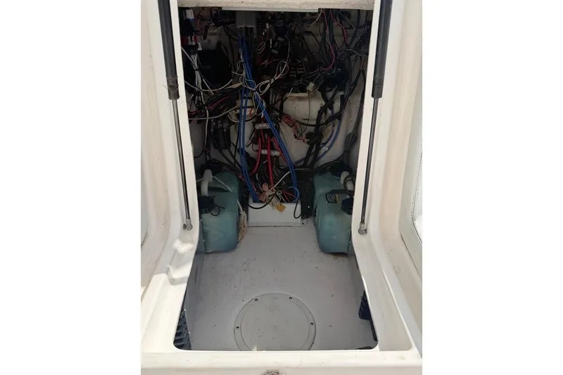Slide: The Image of Interior wiring of a 1997 Wellcraft 302 Scarab Sport boat, showcasing electrical components. - 22