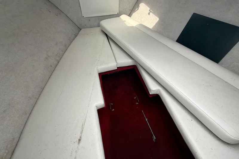 Slide: The Image of Interior cabin of 1997 Wellcraft 302 Scarab Sport boat with white seating. - 23
