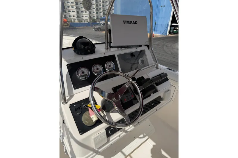 Slide: The Image of Control panel of a 1997 Wellcraft 302 Scarab Sport boat with steering wheel and gauges. - 7