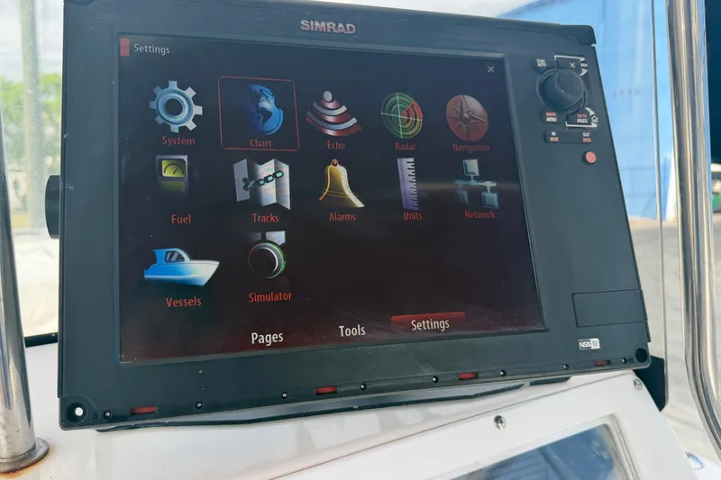Slide: The Image of Simrad navigation system on 1997 Wellcraft 302 Scarab Sport boat dashboard. - 8