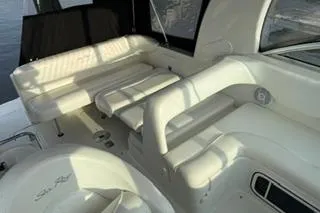 Slide: The Image of Dashboard of a 2004 Sea Ray Sundancer 260 boat with gauges and controls. - 11