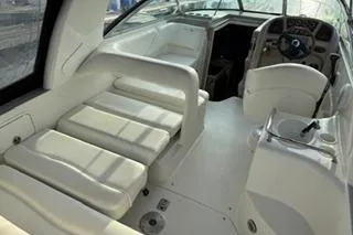 Slide: The Image of Dashboard of a 2004 Sea Ray Sundancer 260 boat with gauges and controls. - 12