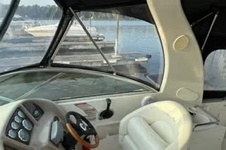 Slide: The Image of 2004 Sea Ray Sundancer 260 cabin interior with kitchenette and seating area. - 16