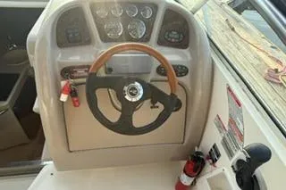 Slide: The Image of Control panel of a 2004 Sea Ray Sundancer 260 boat with stereo system. - 19