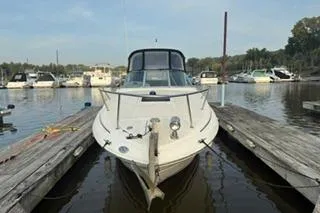 Slide: The Image of 2004 Sea Ray Sundancer 260 interior with sink and seating area. - 5