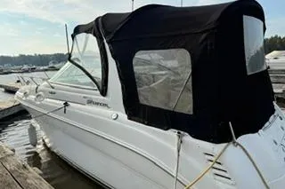 Slide: The Image of Interior view of 2004 Sea Ray Sundancer 260 boat, featuring helm and seating area. - 6