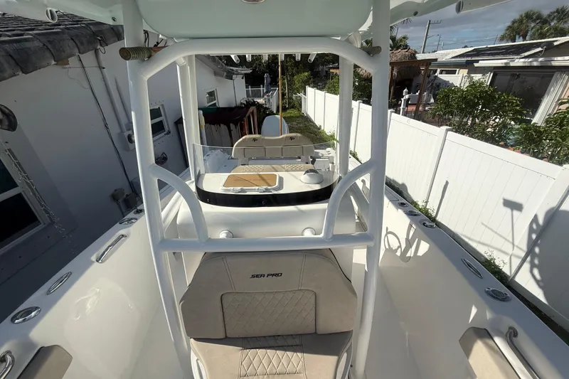 Slide: The Image of 2023 Sea Pro 219 Deep V CC boat in residential backyard setting. - 13