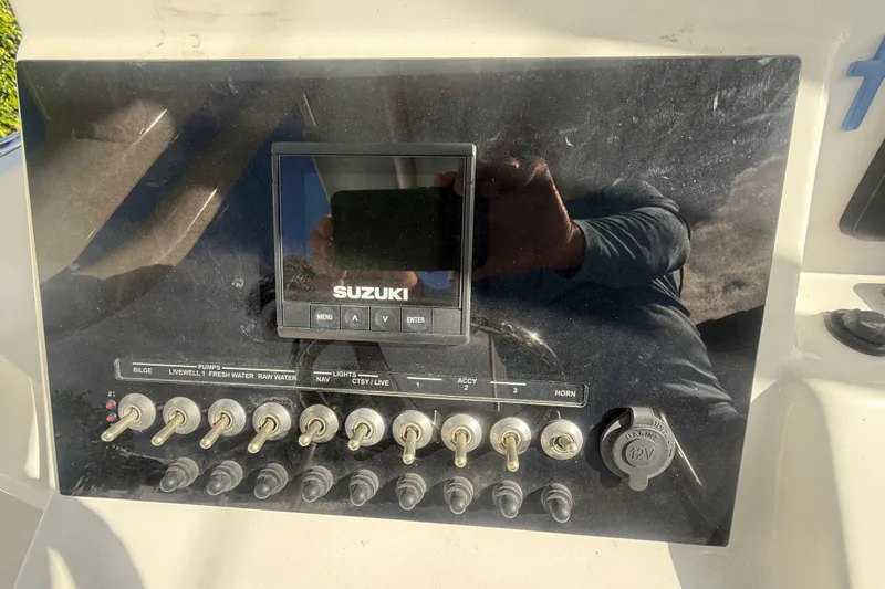 Slide: The Image of Control panel of 2023 Sea Pro 219 Deep V CC boat with Suzuki display. - 14