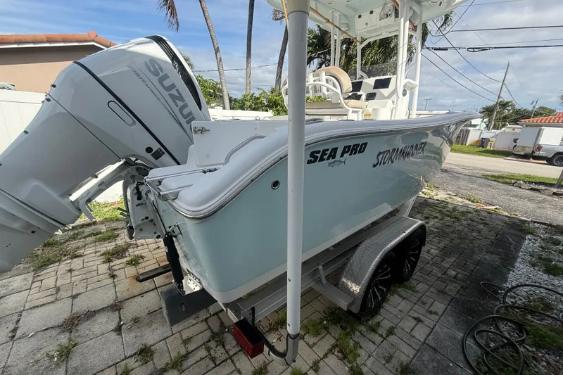 Slide: The Image of 2023 Sea Pro 219 Deep V CC boat with Suzuki outboard engine on a trailer. - 4